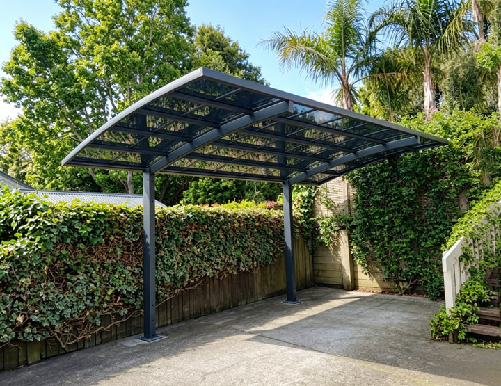 Carport structure with greenery in the background