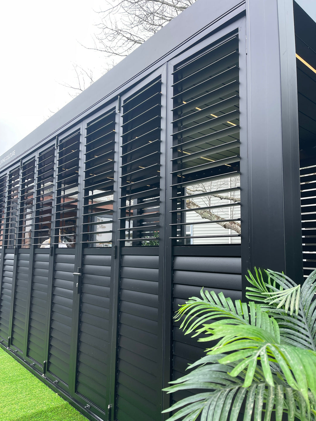 Caribbean Wall Mounted Pergola Bifold Shutter Wall